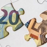 Jigsaw pieces with euro banknotes