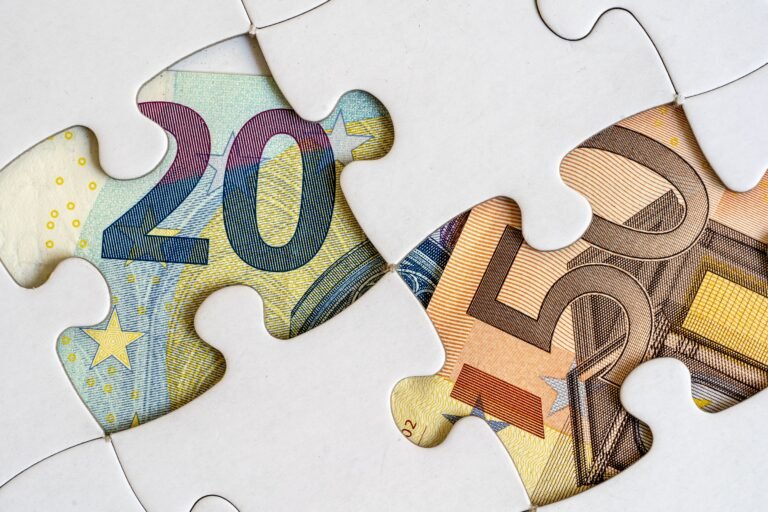 Jigsaw pieces with euro banknotes
